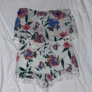 Floral strapless romper with pom-pom trim